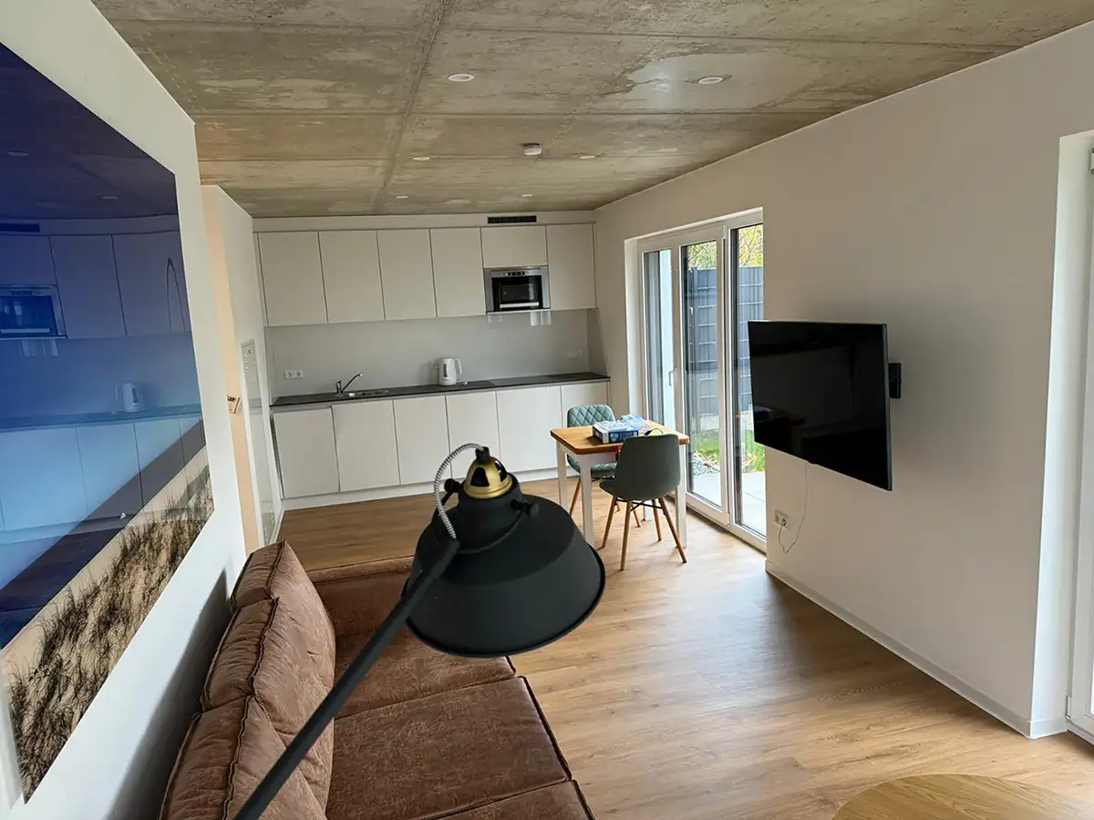 Living room overlooking dining area and kitchenette.